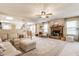 Bright living room with a fireplace, comfortable seating, and open to dining area at 14291 Holly Berry Cir, Fishers, IN 46038