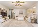 Bright living room featuring a large sectional couch, patterned rug, and a view to the kitchen at 14291 Holly Berry Cir, Fishers, IN 46038