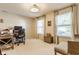 Bright office features hardwood floor, neutral decor, and abundant natural light from large windows at 14291 Holly Berry Cir, Fishers, IN 46038