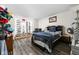 Stylish bedroom with a large bay window and a display of baseball caps and shoes at 1446 N Illinois St, Indianapolis, IN 46202