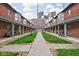 Brick courtyard between buildings featuring lush lawn and walking path at 1446 N Illinois St, Indianapolis, IN 46202