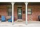 Inviting front porch with seating area and classic brick facade at 1446 N Illinois St, Indianapolis, IN 46202