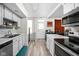 Bright kitchen with white cabinetry and stainless steel appliances at 1446 N Illinois St, Indianapolis, IN 46202