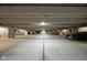 This is an expansive concrete parking garage with numbered spaces and multiple parked cars at 1446 N Illinois St, Indianapolis, IN 46202