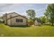 Exterior of house with a large backyard and wooden deck on a sunny day at 16226 Montrose Ln, Westfield, IN 46074