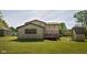 Exterior of house with a large backyard and wooden deck on a sunny day at 16226 Montrose Ln, Westfield, IN 46074