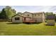 Exterior of house with a large backyard and wooden deck on a sunny day at 16226 Montrose Ln, Westfield, IN 46074