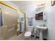 Bathroom features standard white toilet and sink with shower and gold accents at 16226 Montrose Ln, Westfield, IN 46074