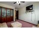 Bedroom with decorative glass closet doors, TV, sofa and overhead lighting at 16226 Montrose Ln, Westfield, IN 46074