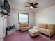 Bedroom showcasing sofa, armchair, ottoman, ceiling fan, and large window for natural light at 16226 Montrose Ln, Westfield, IN 46074