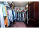 Walk-in closet featuring ample storage space with shelves, clothing racks, and organized boxes at 16226 Montrose Ln, Westfield, IN 46074