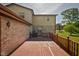 Spacious wooden deck features red railing and partial brick wall and home exterior at 16226 Montrose Ln, Westfield, IN 46074