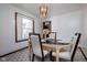Dining room with hanging light fixture and large window create a bright, enjoyable space at 16226 Montrose Ln, Westfield, IN 46074