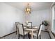 Formal dining room features hanging light fixture and room for at least four in this beautiful home at 16226 Montrose Ln, Westfield, IN 46074