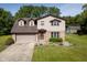 Lovely two-story home with a well-manicured lawn, an attached two-car garage, and mature trees in the backyard at 16226 Montrose Ln, Westfield, IN 46074