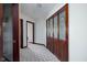 Hallway featuring closet with wood-framed glass doors at 16226 Montrose Ln, Westfield, IN 46074