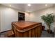 This private room houses a relaxing wooden hot tub and serene indoor greenery at 16226 Montrose Ln, Westfield, IN 46074