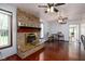 Inviting living room features a brick fireplace and hardwood floors with view to the dining area at 16226 Montrose Ln, Westfield, IN 46074