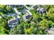 Aerial view of new construction single-Gathering homes in a neighborhood with mature trees and well-manicured lawns at 16890 Catkins Ct, Westfield, IN 46074