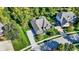An aerial view of a house with a gray roof, a concrete driveway, and green landscaping at 16890 Catkins Ct, Westfield, IN 46074