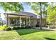 The backyard features a brick exterior with covered patio and fire pit perfect for outdoor living at 16890 Catkins Ct, Westfield, IN 46074