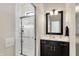 Stylish bathroom showcasing a sleek shower and vanity with a modern mirror at 16890 Catkins Ct, Westfield, IN 46074
