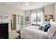 Cozy bedroom with cool-toned walls, decorative accents, and a serene atmosphere at 16890 Catkins Ct, Westfield, IN 46074