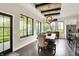 Bright dining area with large windows, hardwood floors and access to kitchen at 16890 Catkins Ct, Westfield, IN 46074