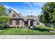 Charming brick home with well-manicured lawn and lush landscaping, complemented by a classic architectural design at 16890 Catkins Ct, Westfield, IN 46074
