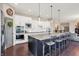 Gourmet kitchen with granite counters, stainless appliances, and breakfast bar at 16890 Catkins Ct, Westfield, IN 46074