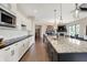 Gourmet kitchen with granite counters, stainless appliances, and open floor plan at 16890 Catkins Ct, Westfield, IN 46074