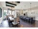 Eat-in kitchen with white cabinets, large island, breakfast bar, and wood-beamed ceilings at 16890 Catkins Ct, Westfield, IN 46074