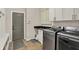 This laundry room includes a washer, dryer, and lots of storage at 16890 Catkins Ct, Westfield, IN 46074