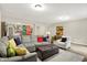 Basement Gathering room features a sectional sofa, decorative pillows, area rug and seamless transition to a game area at 16890 Catkins Ct, Westfield, IN 46074