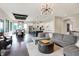 Expansive open-concept living room with stylish furnishings, leading to a modern kitchen and dining area at 16890 Catkins Ct, Westfield, IN 46074