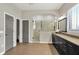 Large main bathroom featuring a double vanity, wood floors, and a walk-in shower at 16890 Catkins Ct, Westfield, IN 46074