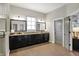 Bright and spacious main bathroom with double vanity, wood floors, and glass enclosed shower at 16890 Catkins Ct, Westfield, IN 46074