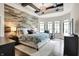 Luxurious main bedroom with wood accent wall, wood beam ceiling, and large windows at 16890 Catkins Ct, Westfield, IN 46074