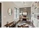 Well-lit home office featuring hardwood floors, custom built-ins, decorative walls, and a cozy work space at 16890 Catkins Ct, Westfield, IN 46074