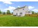 Expansive backyard view showcasing a spacious lawn, patio, and fencing for privacy and outdoor enjoyment at 18711 Crestline Ct, Noblesville, IN 46060