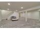 Finished basement with neutral walls and carpet, illuminated by recessed lighting and equipped with a futon at 18711 Crestline Ct, Noblesville, IN 46060
