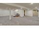Spacious, finished basement with neutral paint, recessed lighting, carpet, a futon and staircase at 18711 Crestline Ct, Noblesville, IN 46060