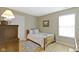 Bedroom with a wood frame bed, plush rug, and plenty of natural light at 18711 Crestline Ct, Noblesville, IN 46060