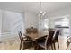 Dining room with hardwood floors and a view to the kitchen and stairway at 18711 Crestline Ct, Noblesville, IN 46060