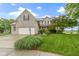 Charming two-story home with a well-manicured lawn, attached garage, and beautiful landscaping at 18711 Crestline Ct, Noblesville, IN 46060