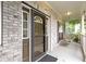 Inviting front porch with brick facade, complemented by a charming swing at 18711 Crestline Ct, Noblesville, IN 46060