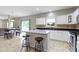 Open-concept kitchen features a spacious island, stainless steel appliances, and adjacent dining area at 18711 Crestline Ct, Noblesville, IN 46060