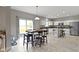 Dining room with access to a modern kitchen area and a comfortable living room at 18711 Crestline Ct, Noblesville, IN 46060