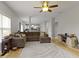Spacious living room with hardwood floors, comfortable seating, and seamless flow to the kitchen at 18711 Crestline Ct, Noblesville, IN 46060