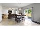 Cozy living room with a fireplace, shiplap accent wall, comfortable seating, and access to the backyard at 18711 Crestline Ct, Noblesville, IN 46060